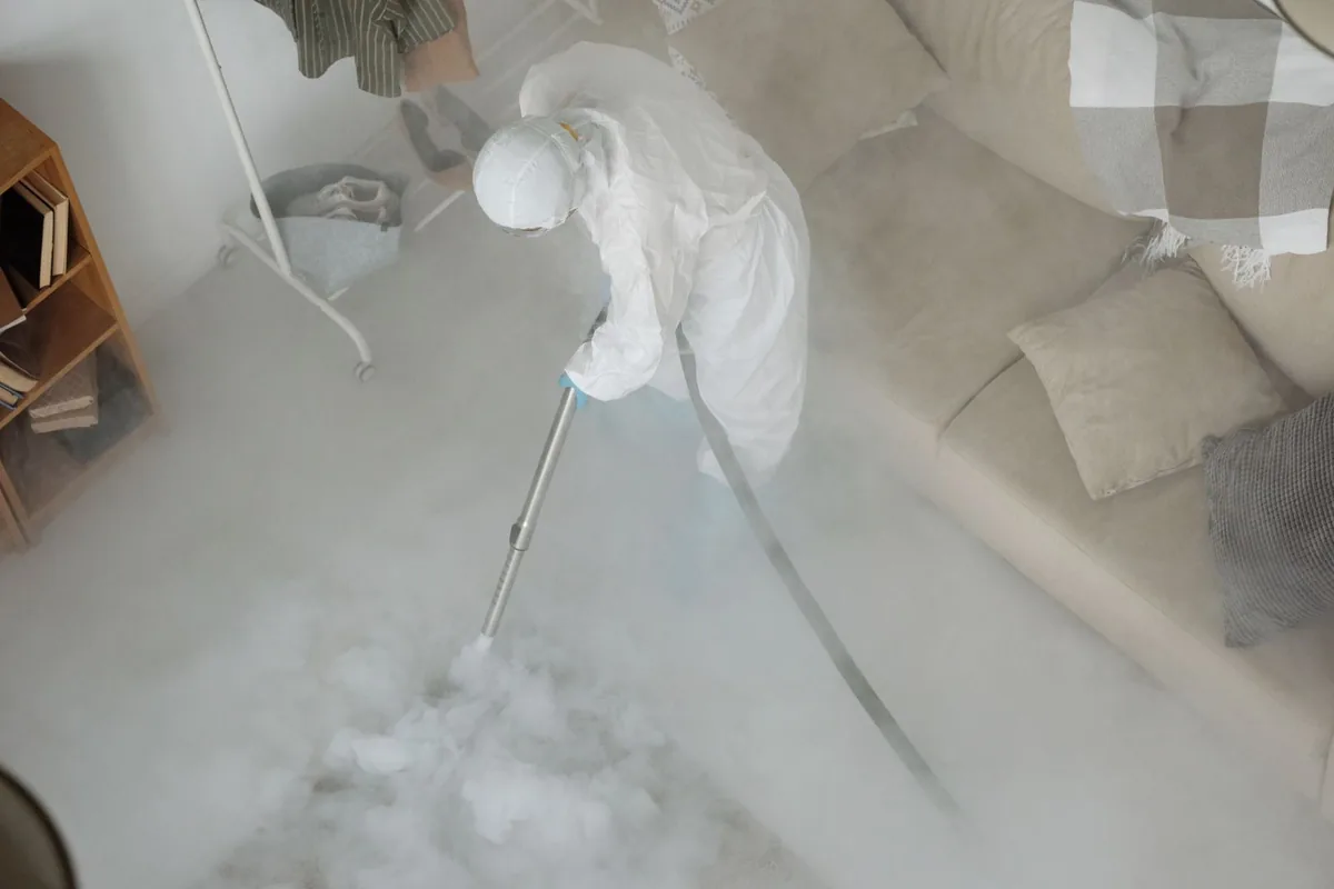 Biohazard cleanup technician in protective equipment, Point Pleasant, WV